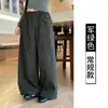 Pantalones anchos de pierna ancha, corte holgado, estilo coreano de alta costura para mujer, colección otoño 2026, con cintura de cordón, bolsillos grandes y un diseño relajado hasta el suelo.