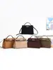Bolsa de Mão Patchwork com Textura de Camurça Outono Inverno 2026 Nova Feminina Estilo Coreano Vintage Ombro Único Transversal Bolsa Platina