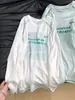 Camiseta branca de manga longa estilo americano com proteção solar para mulheres, nova de 2026 para o verão, fina, cobrindo o corpo, top soltinho e que afina
