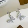 Pendientes de Moda Mariposa de Cristal Degradado Pequeños Frescos Dulces Juguetones Exquisitos Súper Hada Temperamento Pendientes de Alto Grado Versátiles