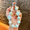 Corrente de Chaveiro para Celular com Contas de Flor de Cerejeira Luminosa Pingente de Bolsa Exquisito Chaveiro de Carro Presente Acessórios para Capa de Celular