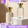 Botella de perfume con atomizador, de vidrio transparente, con forma de bayoneta, de 50/100 ml, con prensa y subenvasado.