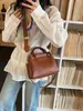 Tendencia transfronteriza 2026 nuevo modelo de bolso madre-hija, bolso de hombro y cruzado moderno y versátil, bolso cubo de mano de nicho con textura