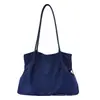 Bolso tote minimalista de estilo coreano con un aire relajado, color liso, nueva colección otoño 2026, gran capacidad, adecuado para el trabajo y los desplazamientos, bolso de hombro o bolso de axila