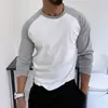 Hombre musculoso estilo americano, colorblock otoño e invierno, capa base casual de manga larga para deportes y fitness, estilo minimalista