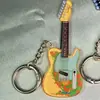 Nuevo llavero acrílico de alta calidad de suministro directo, llavero creativo de violín, colgante para bolso con impresión de logotipo