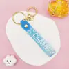 Item popular de e-commerce de comércio exterior: chaveiro versátil translúcido com alça de couro, acessório de cordão de chave de pulso em PVC revestido de resina