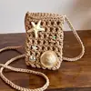 Bolsa Transversal de Ombro Tecida Estilo Férias de Verão 2026 Transfronteiriça Bolsa Fofa para Celular Bolsa Feminina Nicho Vazada