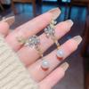 Versión coreana de los populares aretes de flor de perla de Corea del Sur para mujer, nicho ins de lujo, aretes de sauce de cristal al por mayor