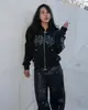 Sudadera con capucha y cremallera de estilo punk callejero retro americano con pedrería estampada, adecuada tanto para hombres como para mujeres, moderna y casual