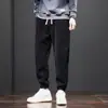 Pantalones de chándal de pana para otoño para hombre, pantalones casuales de retazos, corte holgado, versátiles, pantalones jogger de moda, pantalones largos para hombre