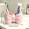 Soporte creativo para cepillo de dientes eléctrico con forma de lazo, organizador de cepillos de dientes de escritorio para parejas, estante de almacenamiento de pasta de dientes y cepillo de dientes para baño
