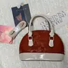 2025 Outono e Inverno Novo Estilo Coreano Moda Retrô Bolsa Concha Portátil Casual Casual Ombro Mensageiro Bolsa Feminina