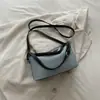 Elegante bolso de mujer 2026 otoño nuevo bolso de axila para el trabajo, bolso de hombro cruzado de diseño de nicho moderno y simple
