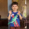 26 Camisetas de Manga Curta para Meninos Moda Europeia e Americana Estampa de Dinossauro Camisetas de Gola Redonda para Crianças Fornecimento Transfronteiriço Roupas Infantis Camisetas de Manga Curta de Dinossauro