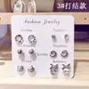 Fabricantes de fuentes deletrean un lote de 6 pares de aretes pequeños rojos de red, aretes pequeños y frescos de Joker simples, aretes al por mayor