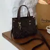 Bolsas de Mano Retro de Gama Alta para Mujer 2025 Textura de Gama Alta Bolso Cruzado de Nicho Bolso Presbiópico Nuevo Transfronterizo