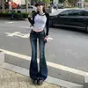Estilo retro americano 2026, cintura baixa, versátil, caimento justo, jeans boca de sino outono/inverno para mulheres, calça comprida, disponível para drop shipping