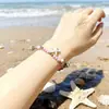 Pingente Popular Europeu e Americano Transfronteiriço de Turquesa Concha Estrela do Mar Pérola Contas de Arroz Feito à Mão Pulseira Comemorativa de Viagem Atração