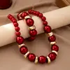Estilo simples europeu e americano design de personalidade da moda colar pulseira de pérola artificial vermelha conjunto de duas peças feminino sensação de alta qualidade