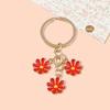 Llavero pequeño con colgante especial transfronterizo, bonito y pequeño accesorio con flores frescas, llavero de metal para colgar en el bolso.