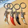 R308 Pingente Imitação Dente de Lobo Chaveiro Dourado Chaveiro de Pendurar Moeda de Um Yuan Duas Moedas Local de Atacado