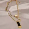 Cadena de suéter de acero de titanio 2025 nuevo otoño e invierno collar largo de doble capa con colgante cuadrado diseño de nicho para mujer sentido de diseño accesorios de alta gama