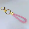 Llavero de cuerda trenzada de cuero PU con hebilla de langosta redonda, llavero de amor para hombres y mujeres, cuerda de mano para bolsa, cordón para el cuello, venta al por mayor directa de fábrica