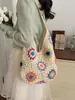Llegada de verano de moda: un bolso tejido floral colorido, perfecto para vacaciones y la playa, un bolso de hombro casual