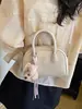 Bolso de Mano Minimalista Boston 2026 Modelo Nuevo Bolso de Bowling de Gama Alta Versátil de Nicho Bolso Cuadrado Pequeño Bolso Cruzado