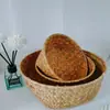 Venda por atacado de fábrica vaso de flor de palha trançada redondo vaso cesta organizador de mesa cesta de armazenamento de cosméticos