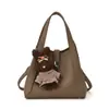 Bolsa Balde Simples de Mão Estilo Coreano para Mulheres Modelo Novo Inverno 2026 Bolsa de Ombro Transversal Elegante Minimalista de Alta Qualidade