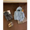 Suéter de punto largo a rayas estilo coreano con bolsillos, con diseño de capucha y cierre de cremallera, un cárdigan de punto holgado para mujer