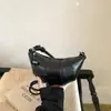 Bolso de axila de nicho transfronterizo para mujer con forma de cuerno, nuevo y moderno bolso tipo dumpling de moda 2026, bolso de hombro y cruzado simple y versátil