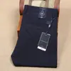 Pantalones de traje de negocios para hombre de ajuste recto y delgado, elásticos en cuatro direcciones, de nailon, finos, sin planchar, antiarrugas, pantalones casuales para hombre de primavera y verano