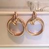 Accesorios de comercio exterior exagerados, venta al por mayor, moda simple, liso, pendientes de círculo grande, estilo punk, discoteca, joyería para las orejas europea y americana