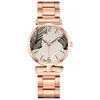 Comercio exterior nuevo correa de acero simple hoja de palma esfera de moda para mujer casual de negocios versátil reloj de cuarzo caja de regalo