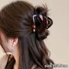 Elegante pinza de garra floral para peinado semi-recogido, nuevo modelo 2026 para mujer, pinza de tiburón de tamaño mediano para la parte trasera de la cabeza, accesorio para el cabello