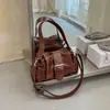 Bolso de axila de nicho de lujo ligero de alta gama para mujer 2026 nuevo otoño súper caliente exquisito bolso de hombro tote para commuting