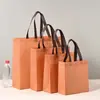 Challenge Wolf Fábrica de Empaques Venta al por Mayor Bolsas de Empaque para Ropa No Tejidas Personalizadas con Broches de Presión para Tiendas de Ropa