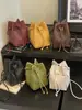 Bolsa de Hombro Cruzada Tejida con Cordón Versátil de Moda Otoño 2026 Diseño de Nicho Bolso Cubo