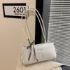 Bolso de axila coreano simple y elegante para mujer, nueva colección primavera 2026, con una estética dulce y fresca, un diseño único, y se puede llevar como bolso de mano o bolso de hombro