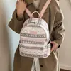 Mochila de mujer estilo casual con estampado de dibujos animados 2026, mochila ligera de doble hombro para niñas, nueva mochila versátil de gran capacidad para estudiantes