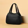 Bolso Estilo Coreano 2026 Nueva Moda Verano Bolso Cesta de Mano Bolso Cubo de Cuero Suave Simple de Hombro Único para Mujer