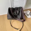 2026 Nuevo Bolso Cubo de Cordón de Cuero Suave Japonés Coreano para Mujer Moda de Nicho Bolso de Hombro Único Diseño Casual Bolso Cruzado