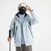 2026 nuevo estilo popular chaqueta polar tres en uno a prueba de viento e impermeable para exteriores para hombres y mujeres, adecuada para otoño e invierno, e ideal para senderismo
