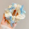 Nuevos coleteros de tela de verano con alto atractivo estético, pequeñas ligas florales para el cabello, accesorios para el cabello lindos y versátiles