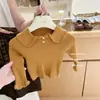 Limón Salado SieteAtuendo ultra favorecedor para niña estilo coreano nuevo suéter de punto y pantalones de pierna ancha a cuadros otoño 2026