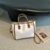 Bolsa tote minimalista de nicho estilo coreano para mulheres, inverno de 2026, grande capacidade, moderna, versátil, bolsa de ombro e sob o braço de alta qualidade