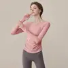 Ropa de yoga para mujer 2024 otoño e invierno nueva con almohadilla en el pecho manga larga ajustada deportiva para correr top ropa de fitness para mujer al por mayor